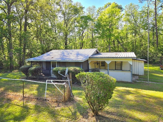 358 Camp Brooklyn Rd, Fitzgerald, GA 31750 - ranch-style home with a porch, metal roof, and a forest view