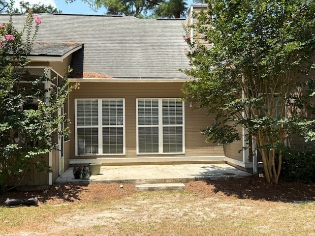 218 Sutton Rd, Tifton, GA 31794 - rear view of property featuring a shingled roof