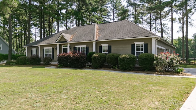 218 Sutton Rd, Tifton, GA 31794 - view of front facade featuring a garage, a front lawn, and a shingled roof