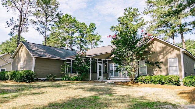 218 Sutton Rd, Tifton, GA 31794 - view of front facade featuring a sunroom and a front lawn