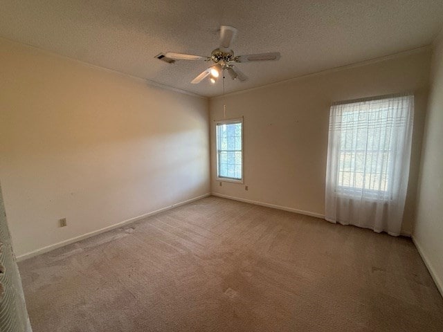 218 Sutton Rd, Tifton, GA 31794 - unfurnished room featuring light colored carpet, a ceiling fan, and a textured ceiling