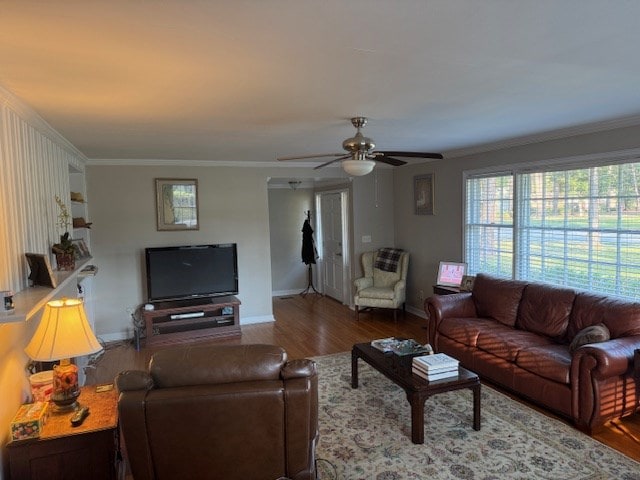 602 20th St, Tifton, GA 31794 - living area featuring wood finished floors, ornamental molding, baseboards, and a ceiling fan