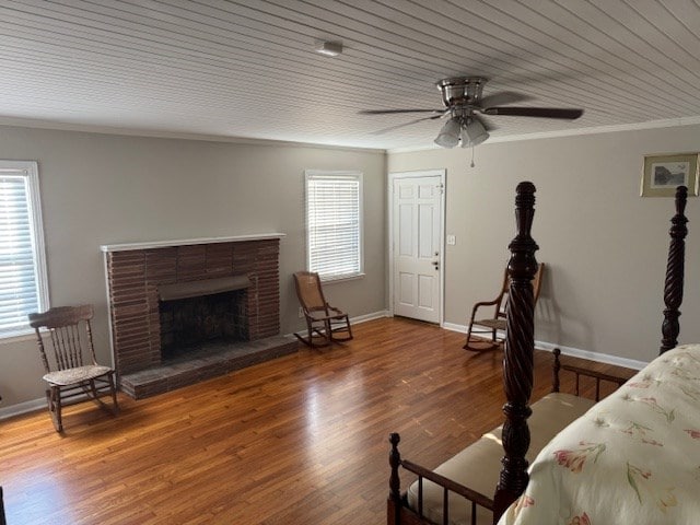 602 20th St, Tifton, GA 31794 - interior space with baseboards, wood ceiling, crown molding, a fireplace, and wood finished floors