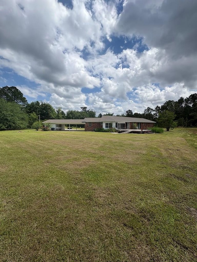 view of yard with a carport