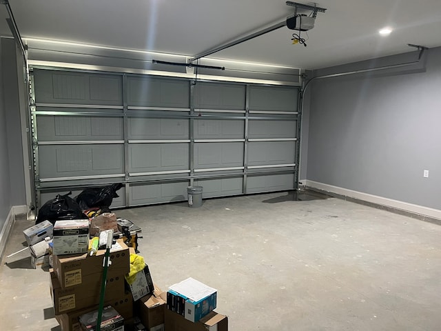64 Mcintosh Pl, Moultrie, GA 31788 - garage featuring baseboards and a garage door opener