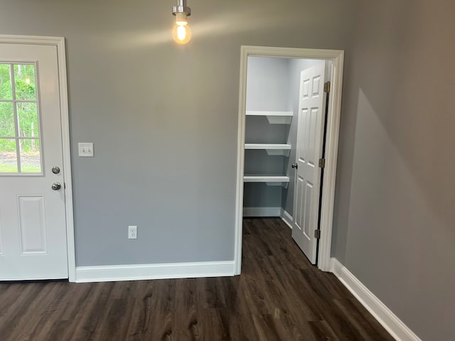 64 Mcintosh Pl, Moultrie, GA 31788 - unfurnished dining area with dark wood-type flooring and baseboards
