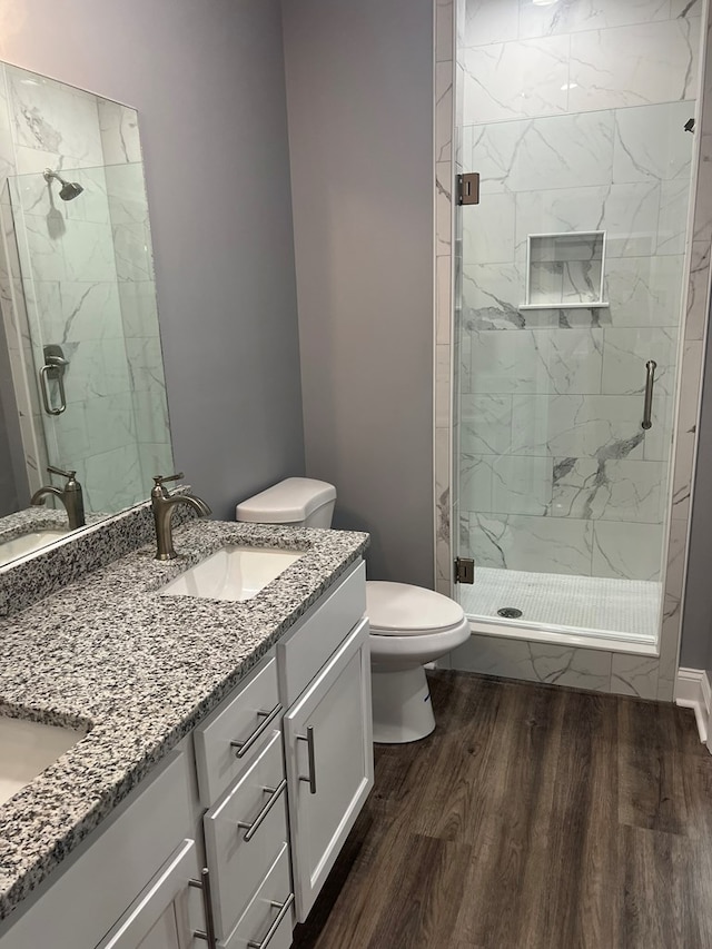 64 Mcintosh Pl, Moultrie, GA 31788 - full bathroom with toilet, vanity, wood finished floors, and a marble finish shower