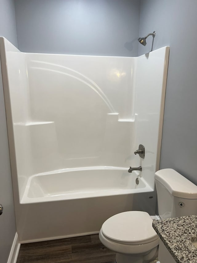 64 Mcintosh Pl, Moultrie, GA 31788 - bathroom featuring toilet, vanity, wood finished floors, and bathtub / shower combination