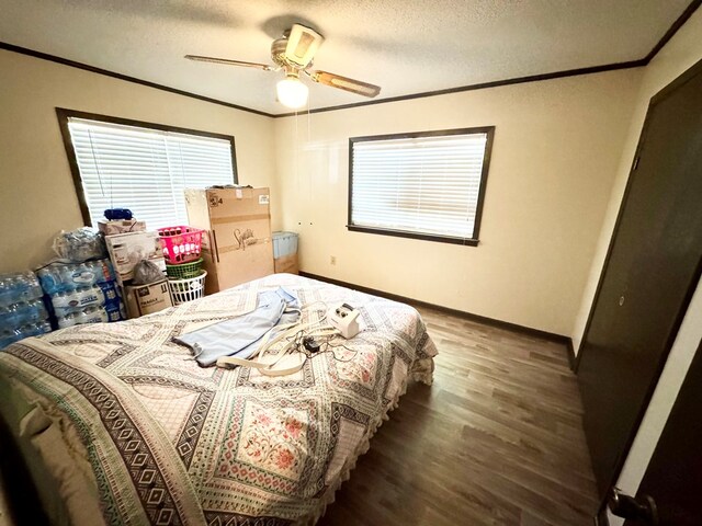 118 Flint St, Fitzgerald, GA 31750 - bedroom with baseboards, crown molding, wood finished floors, and a textured ceiling