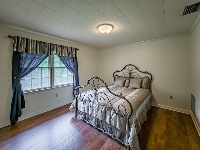 2611 Emmett Dr, Tifton, GA 31794 - bedroom featuring visible vents, baseboards, crown molding, and wood finished floors