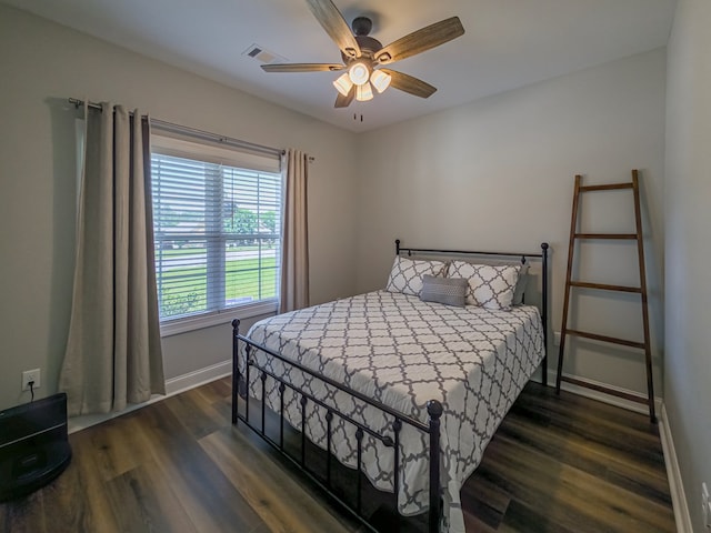 105 Planters Row, Tifton, GA 31793 - bedroom with dark wood-style flooring, baseboards, and ceiling fan
