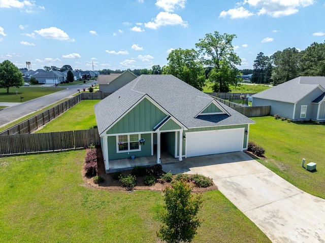 105 Planters Row, Tifton, GA 31793 - view of front of house with board and batten siding, driveway, an attached garage, roof with shingles, and a residential view