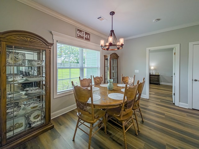 105 Planters Row, Tifton, GA 31793 - dining area with a chandelier, crown molding, dark wood finished floors, and baseboards