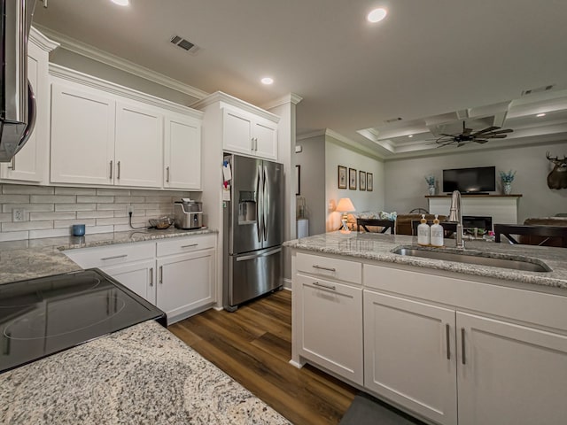 105 Planters Row, Tifton, GA 31793 - kitchen featuring stainless steel fridge with ice dispenser, a sink, a ceiling fan, recessed lighting, and ornamental molding