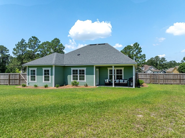 105 Planters Row, Tifton, GA 31793 - back of house with a shingled roof and a patio