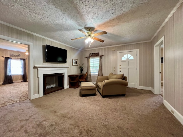 living room featuring crown molding, carpet flooring, and a healthy amount of sunlight