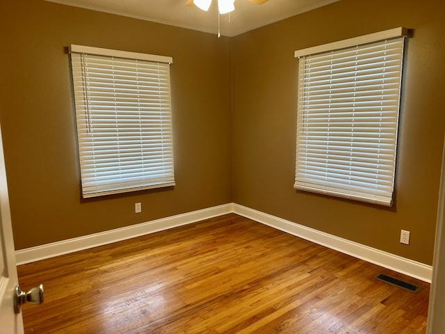 1222 Minton Rd, Sylvester, GA 31791 - empty room with wood finished floors and ceiling fan