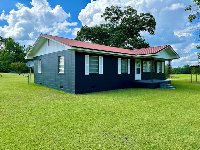 1222 Minton Rd, Sylvester, GA 31791 - view of home's exterior with crawl space, a yard, covered porch, and a metal roof
