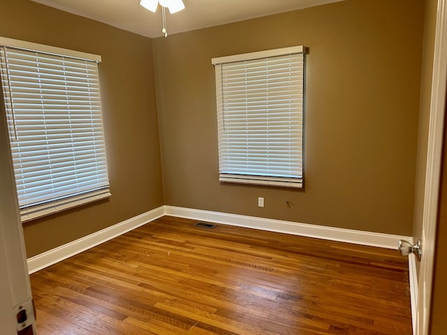 1222 Minton Rd, Sylvester, GA 31791 - empty room featuring wood finished floors, ceiling fan, and plenty of natural light