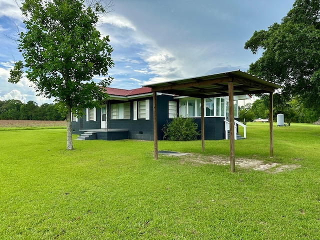 1222 Minton Rd, Sylvester, GA 31791 - rear view of property featuring a yard and a metal roof