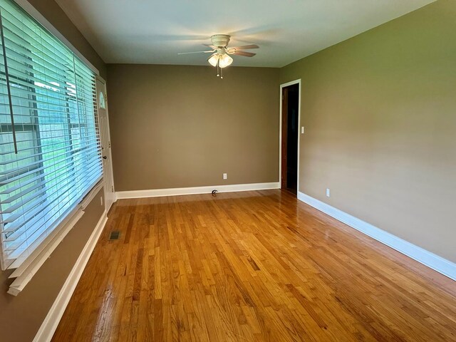 1222 Minton Rd, Sylvester, GA 31791 - empty room with a ceiling fan and wood finished floors
