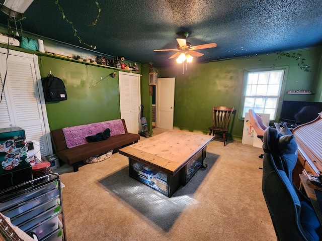 410 W Henderson St, Ocilla, GA 31774 - living room featuring a textured ceiling, ceiling fan, and light carpet