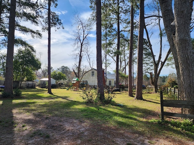 410 W Henderson St, Ocilla, GA 31774 - view of yard featuring a playground and fence
