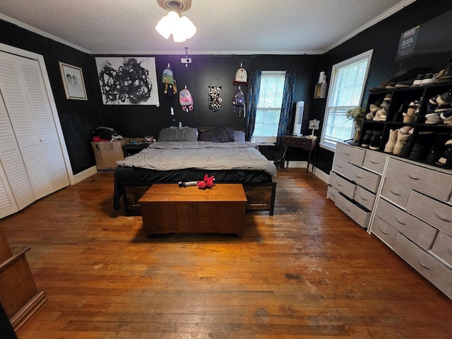410 W Henderson St, Ocilla, GA 31774 - bedroom with wood-type flooring, a textured ceiling, and ornamental molding