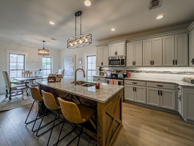 560 Osprey Cir, Tifton, GA 31794 - living room with wood finished floors, a ceiling fan, crown molding, and wainscoting