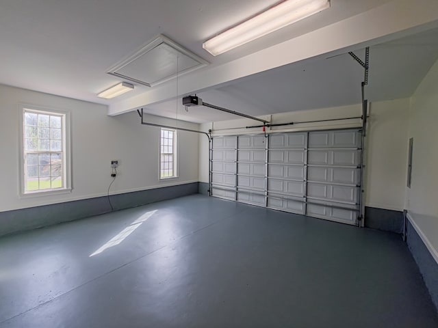 34 Alan Ln, Tifton, GA 31793 - garage featuring a garage door opener and baseboards