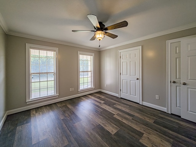 34 Alan Ln, Tifton, GA 31793 - unfurnished bedroom with dark wood-type flooring, baseboards, ornamental molding, and ceiling fan