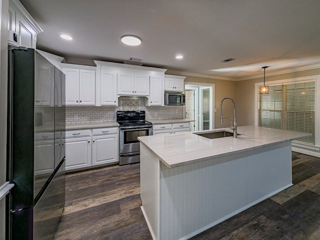 34 Alan Ln, Tifton, GA 31793 - kitchen with freestanding refrigerator, stainless steel microwave, electric stove, a sink, and crown molding