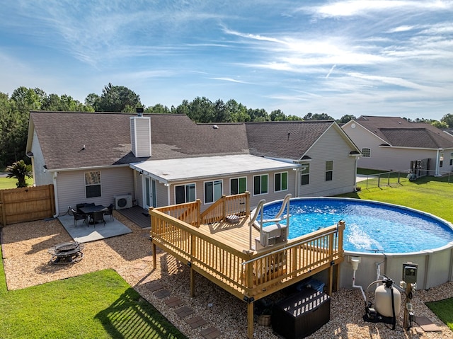 34 Alan Ln, Tifton, GA 31793 - outdoor pool featuring a fire pit, a wooden deck, a cooling unit, and a patio
