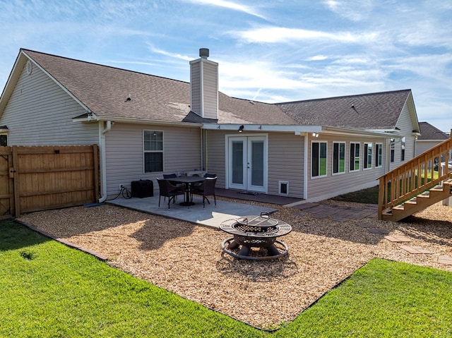 34 Alan Ln, Tifton, GA 31793 - rear view of property with a fire pit, a chimney, a patio, stairs, and roof with shingles