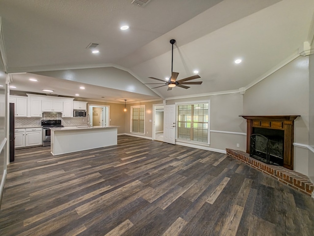 34 Alan Ln, Tifton, GA 31793 - unfurnished living room with a sink, lofted ceiling, a ceiling fan, dark wood-style flooring, and a fireplace