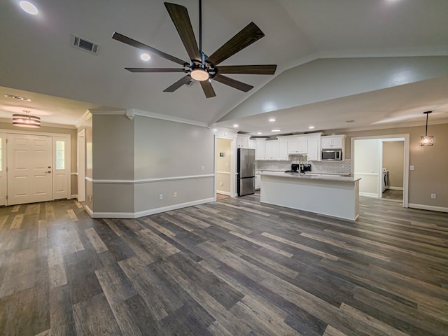 34 Alan Ln, Tifton, GA 31793 - unfurnished living room featuring a ceiling fan, baseboards, recessed lighting, dark wood finished floors, and crown molding