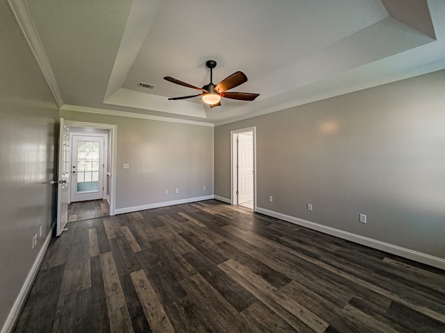 34 Alan Ln, Tifton, GA 31793 - empty room with a tray ceiling, dark wood finished floors, baseboards, ceiling fan, and crown molding