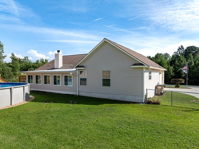 34 Alan Ln, Tifton, GA 31793 - back of property featuring an outdoor pool and a chimney