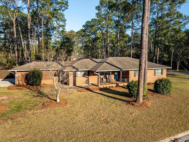 1447 Davis Ave, Tifton, GA 31794 - ranch-style home featuring a porch, a front lawn, and brick siding