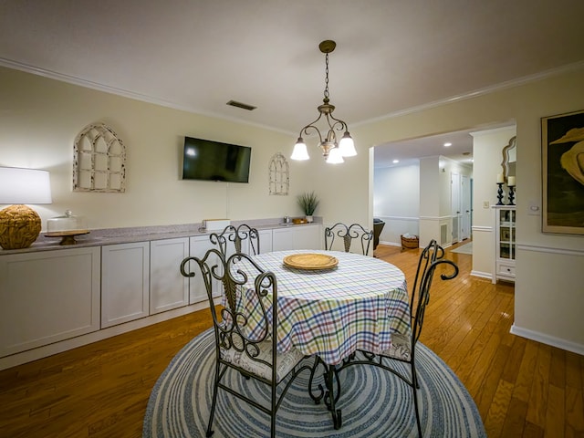 1447 Davis Ave, Tifton, GA 31794 - dining room with visible vents, baseboards, an inviting chandelier, dark wood-style floors, and crown molding