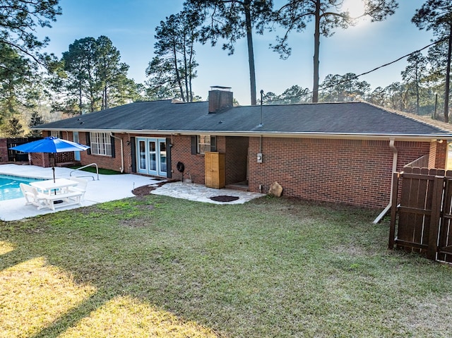 1447 Davis Ave, Tifton, GA 31794 - rear view of property with french doors, a patio area, fence, and brick siding