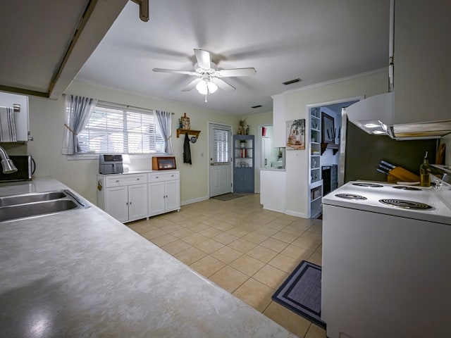 1447 Davis Ave, Tifton, GA 31794 - kitchen with light tile patterned floors, white cabinets, a sink, ceiling fan, and white electric range
