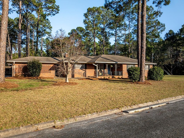 1447 Davis Ave, Tifton, GA 31794 - single story home featuring brick siding, a porch, and a front lawn