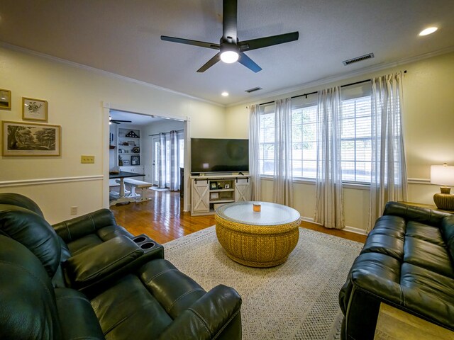 1447 Davis Ave, Tifton, GA 31794 - living area featuring crown molding, wood finished floors, and ceiling fan