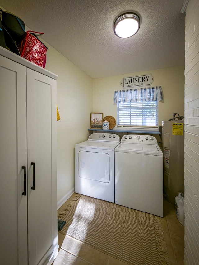 1447 Davis Ave, Tifton, GA 31794 - laundry area with water heater, washing machine and dryer, laundry area, and a textured ceiling