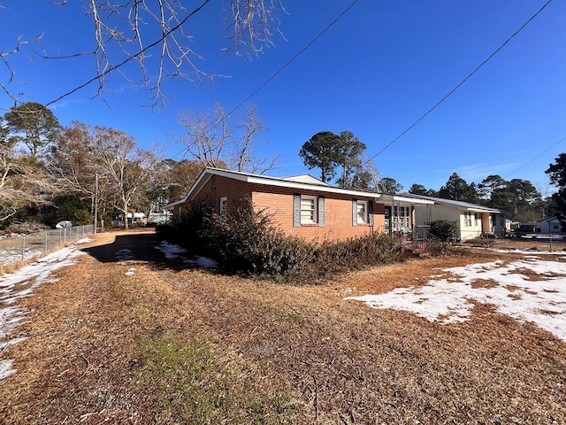 303 W Boulevard Blvd, Ocilla, GA 31774 - view of property exterior with brick siding and fence