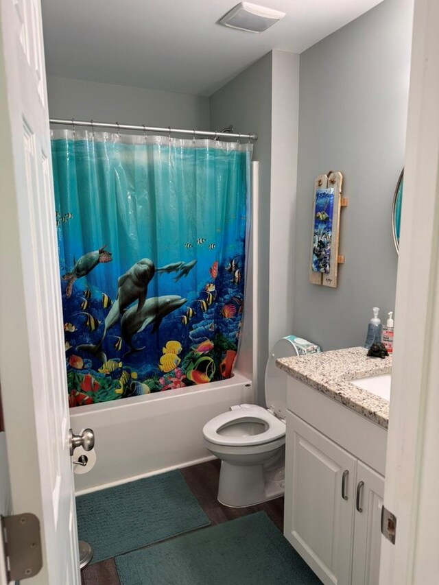 3524 Moss Island Ct, Albany, GA 31721 - full bathroom with vanity, shower / tub combo, toilet, and wood finished floors