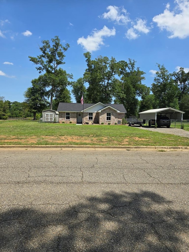 3524 Moss Island Ct, Albany, GA 31721 - view of front of house with a carport, a front lawn, and driveway