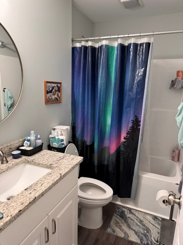 3524 Moss Island Ct, Albany, GA 31721 - bathroom featuring vanity, toilet, shower / tub combo with curtain, and wood finished floors