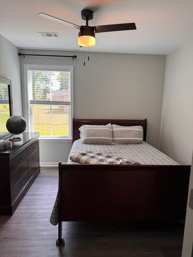 3524 Moss Island Ct, Albany, GA 31721 - bedroom with dark wood finished floors, ceiling fan, and baseboards